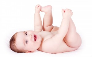 Happy-baby-playing-with-his-feet-1080x675